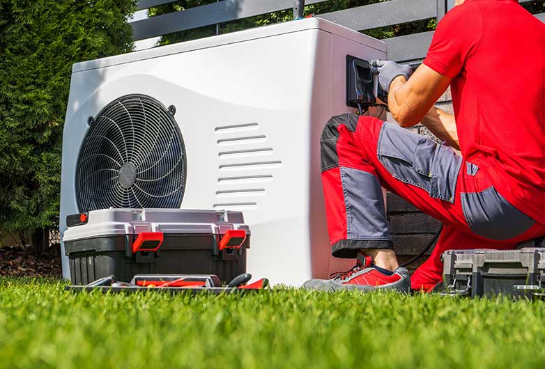 HVAC Technician Repairing Heat Pump HVAC Technician Repairing Heat Pump Cookeville, TN