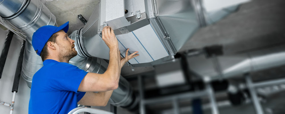 technician checking HVAC ducts in Sparta, TN technician checking HVAC ducts in Sparta, TN